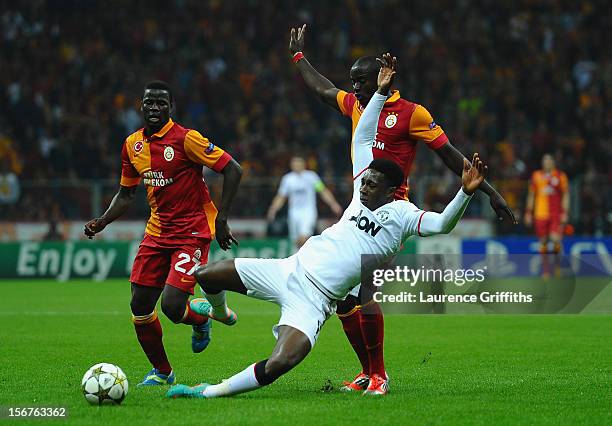 Danny Welbeck of Manchester United battles with Dany Nounkeu and Emmanuel Eboue of Galatasary during the UEFA Champions League Group H match between...