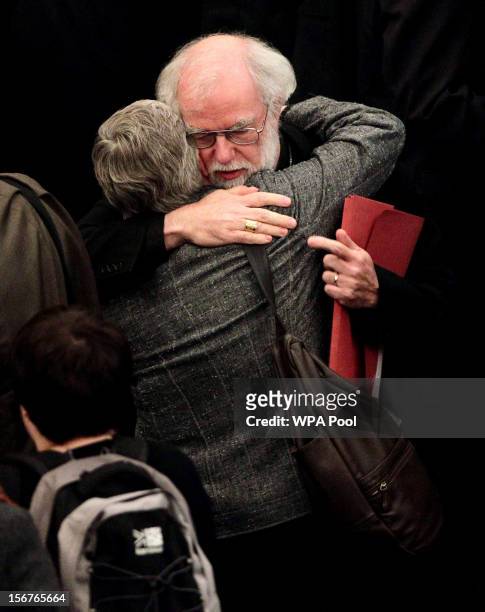 Dr Rowan Williams, the outgoing Archbishop of Canterbury, consoles a colleague after draft legislation introducing the first women bishops in the...