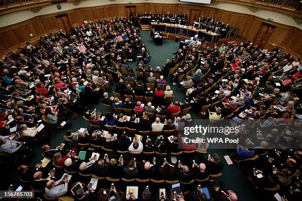 General view of members voting on handsets to decide whether to give final approval to legislation introducing the first women bishops, during a...