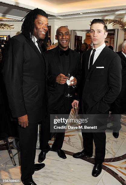 Raye Cosbert, Dale Davis and Reg Traviss attend a drinks reception at the Amy Winehouse Foundation Ball held at The Dorchester on November 20, 2012...