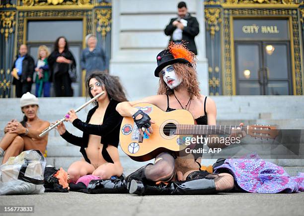 Danny Devero and Natalie Mandeau protest in front of San Francisco's City Hall building on November 20, 2012. San Francisco lawmakers voted to outlaw...