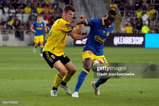 Sean Zawadzki of Columbus Crew and Julian Quinones of America battle for the ball during the first half of the Leagues Cup group stage match at...
