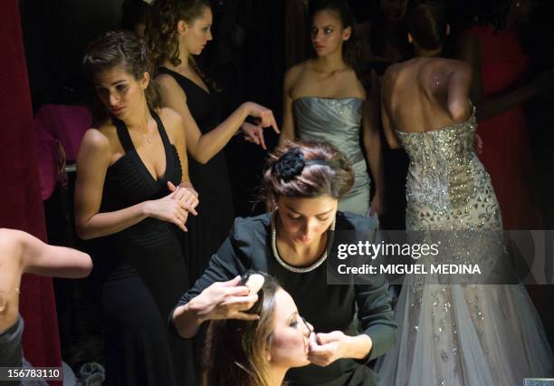 Contestants are pictured backstage on November 20, 2012 in the southern Paris suburb of Rungis during the 2012 Miss Ile-de-France beauty contest. AFP...