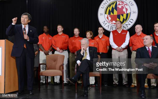 President Wallace Loh, left, makes remarks during a press conference to address the news that the University of Maryland will join the Big 10 college...