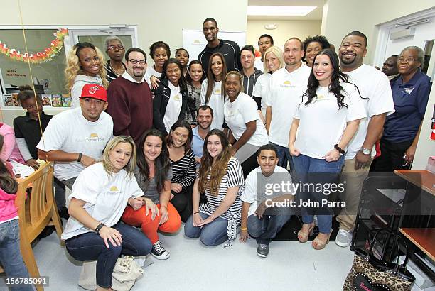 Adrienne Bosh and Chris Bosh with all the volunteers on the 2nd year with the Chapman Partnership to help feed the local families of Miami this...