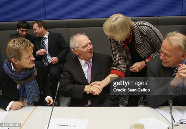 German Finance Minister Wolfgang Schaeuble greets German Greens Party co-Chairwoman Claudia Roth as party members Reneta Kuenast and Juergen Trittin...