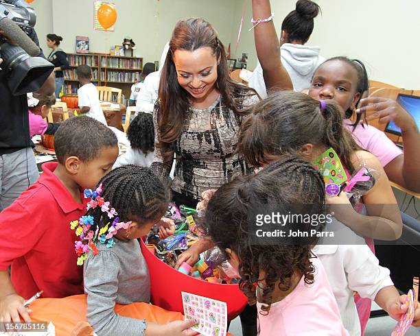 Adrienne Bosh with the Chapman Partnership kids to help feed the local families of Miami this Thanksgiving at Chapman Partnership on November 20,...
