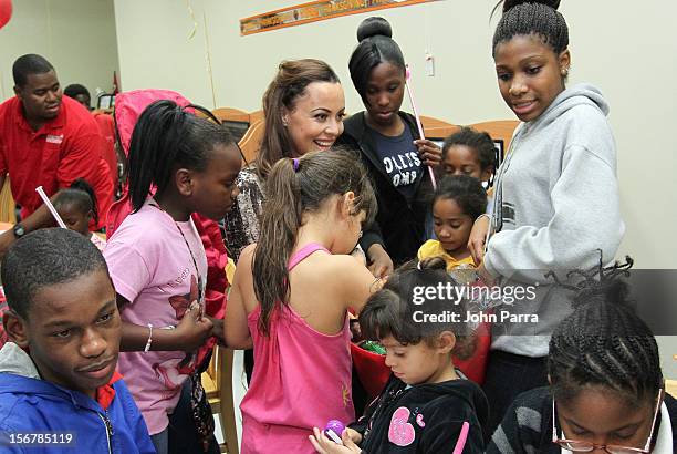 Adrienne Bosh with the Chapman Partnership kids to help feed the local families of Miami this Thanksgiving at Chapman Partnership on November 20,...