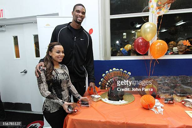 Chris Bosh and Adrienne Bosh attend the 2nd year with the Chapman Partnership to help feed the local families of Miami this Thanksgiving at Chapman...