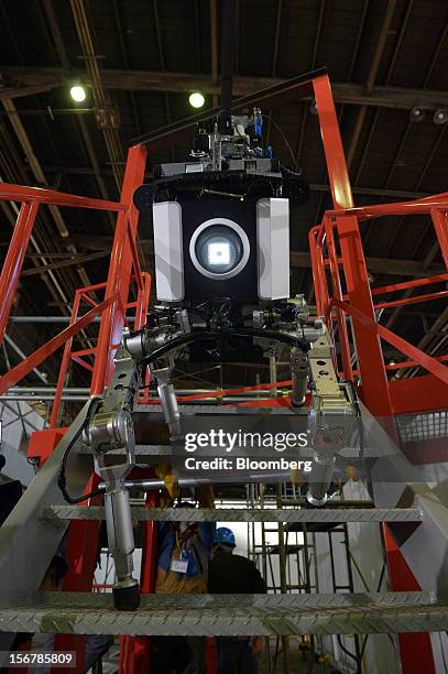 Toshiba Corp. Tetrapod robot walks up stairs at the company's Yokohama Complex in Yokohama City, Kanagawa Prefecture, Japan, on Wednesday, Nov. 21,...