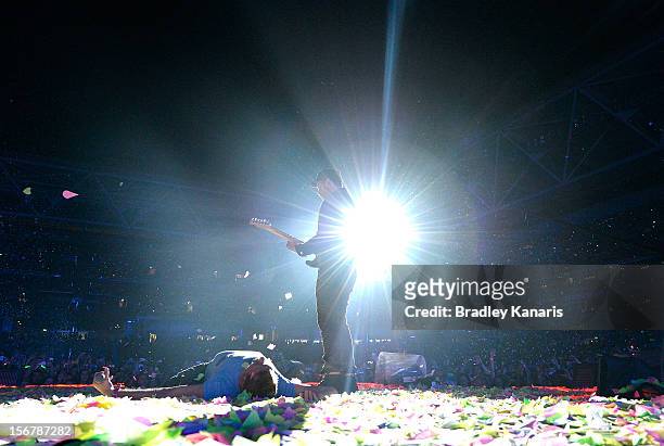 Chris Martin and Jonny Buckland of Coldplay perform live for fans at Suncorp Stadium on November 21, 2012 in Brisbane, Australia.