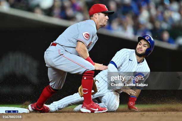 Nick Madrigal of the Chicago Cubs steals second base against Matt McLain of the Cincinnati Reds in the seventh inning at Wrigley Field on July 31,...