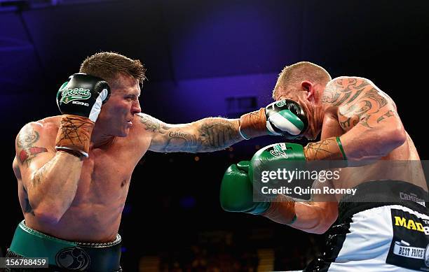 Danny Green of Australia lands a punch to Shane Cameron of New Zealand during their world title bout at Hisense Arena on November 21, 2012 in...