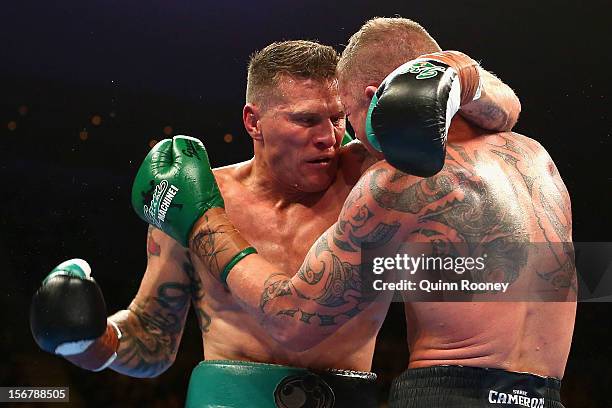 Danny Green of Australia and Shane Cameron of New Zealand exchange blows during their world title bout at Hisense Arena on November 21, 2012 in...