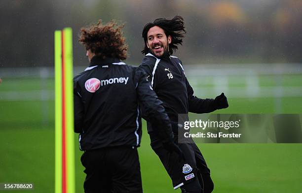 Newcastle players Fabricio Coloccini and Jonas Gutierrez share a joke during Newcastle United training ahead of thursday's UEFA Europa League match...