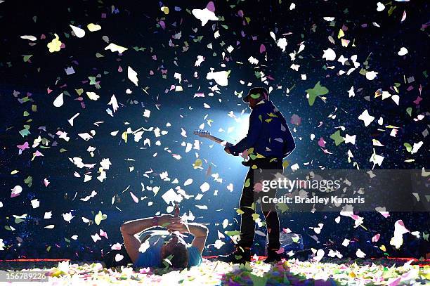 Chris Martin and Jonny Buckland of Coldplay perform live for fans at Suncorp Stadium on November 21, 2012 in Brisbane, Australia.