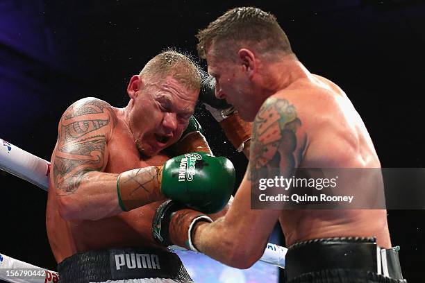 Shane Cameron of New Zealand and Danny Green of Australia exchange blows during their world title bout at Hisense Arena on November 21, 2012 in...