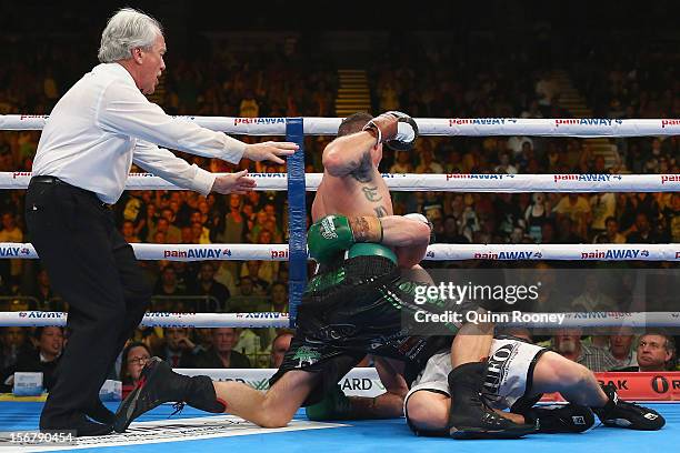 Danny Green of Australia and Shane Cameron of New Zealand wrestle each other to the ground during their world title bout at Hisense Arena on November...