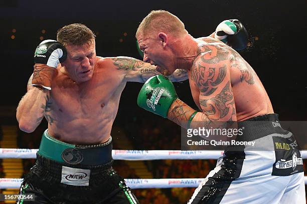 Danny Green of Australia and Shane Cameron of New Zealand exchange blows during their world title bout at Hisense Arena on November 21, 2012 in...