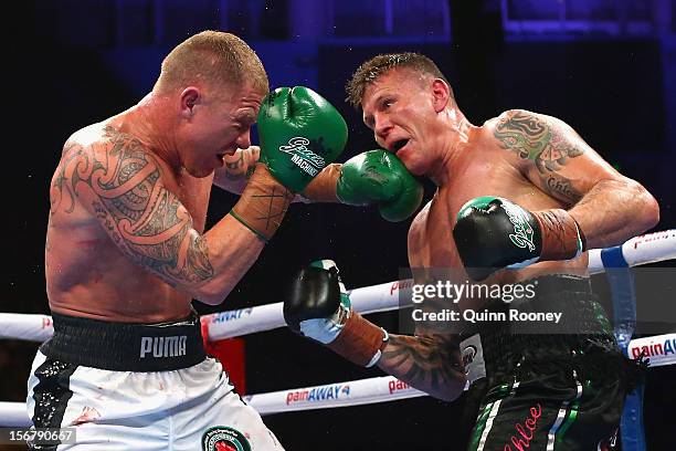 Shane Cameron of New Zealand and Danny Green of Australia exchange blows during their world title bout at Hisense Arena on November 21, 2012 in...