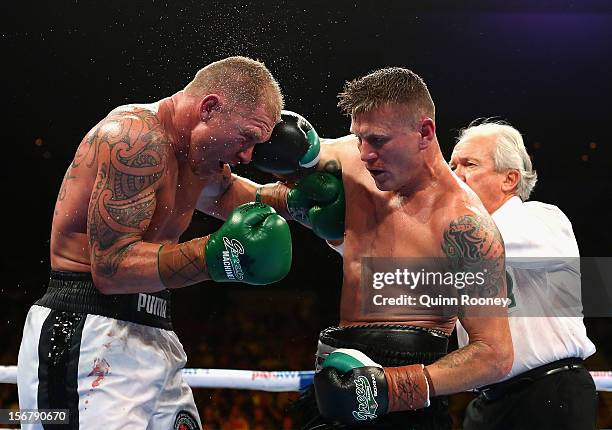 Shane Cameron of New Zealand and Danny Green of Australia exchange blows during their world title bout at Hisense Arena on November 21, 2012 in...