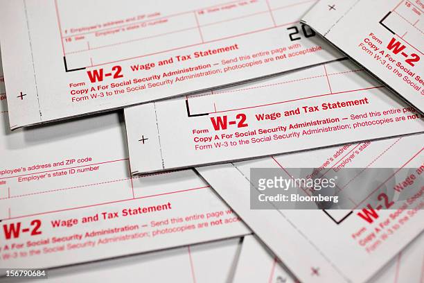 Wage and tax statement forms are arranged for a photograph in Washington, D.C., U.S., on Tuesday, Nov. 20, 2012. President Barack Obama expressed...