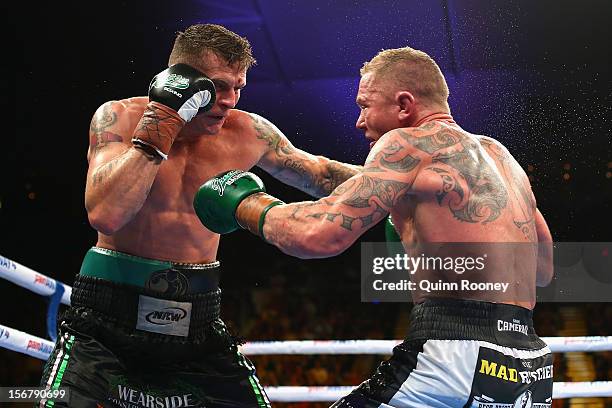 Danny Green of Australia and Shane Cameron of New Zealand exchange blows during their world title bout at Hisense Arena on November 21, 2012 in...