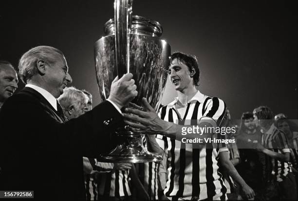 Johan Cruijff recieves the Cup after winning the European Cup final match between Ajax and Juventus at the Red Star Stadium on May 30, 1973 in...