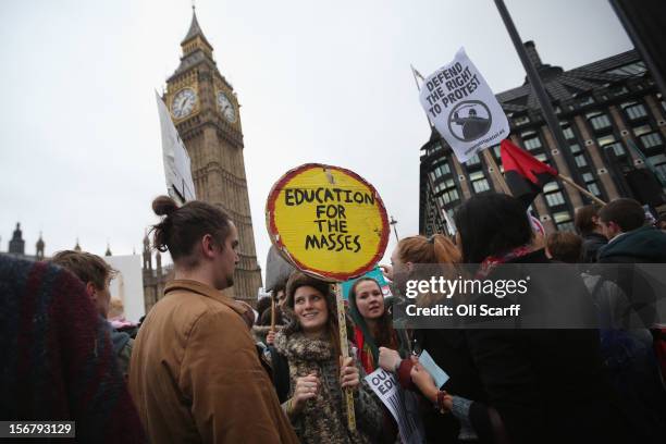 Students protest in front of the Houses of Parliament against the rising costs of further education on November 21, 2012 in London, England. The...