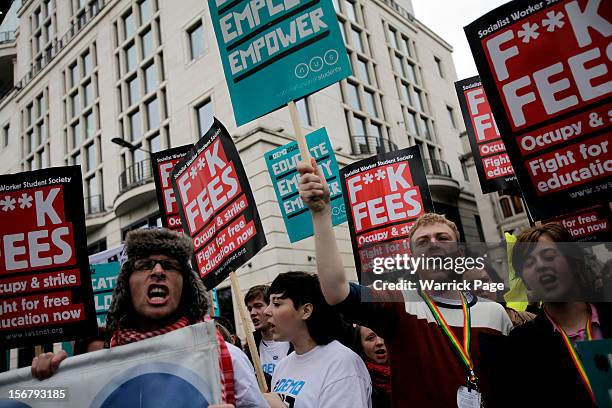 Protesters shout slogans as they gather to demonstrate against education cuts, tuition increases and austerity on November 21, 2012 in London,...