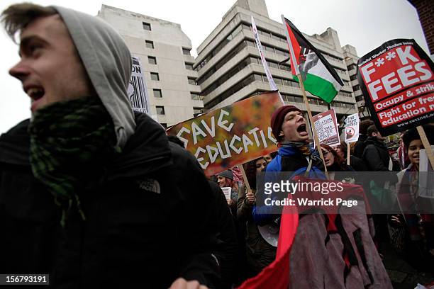Protesters shout slogans as they gather to demonstrate against education cuts, tuition increases and austerity on November 21, 2012 in London,...
