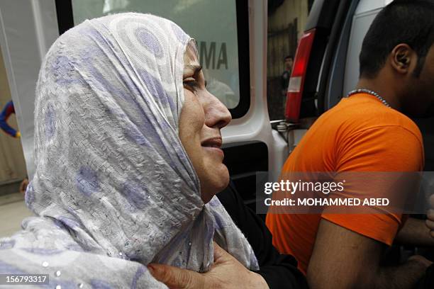 The mother of Palestinian boy Abdel Rahman Majdi Naim cries after her son was killed in a second Israeli strike on the building housing AFP's offices...