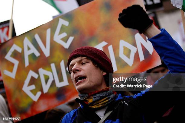 Protestor demonstrating against education cuts, tuition increases and austerity shouts slogans on November 21, 2012 in London, England. The...