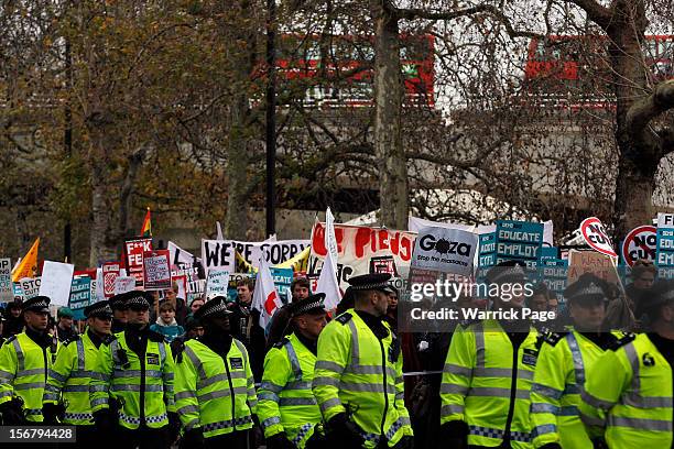 Protesters demonstrating against education cuts, tuition increases and austerity march towards the Houses of Parliament on November 21, 2012 in...