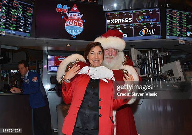 Amy Kule, Executive Producer of Macy's Thanksgiving Day Parade and Santa Claus visit the New York Stock Exchange on November 21, 2012 in New York...