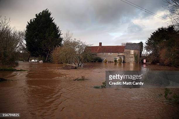 Flood waters surrounding a cottage close to the village of North Curry on November 21, 2012 near Taunton, England. Heavy rain overnight has brought...