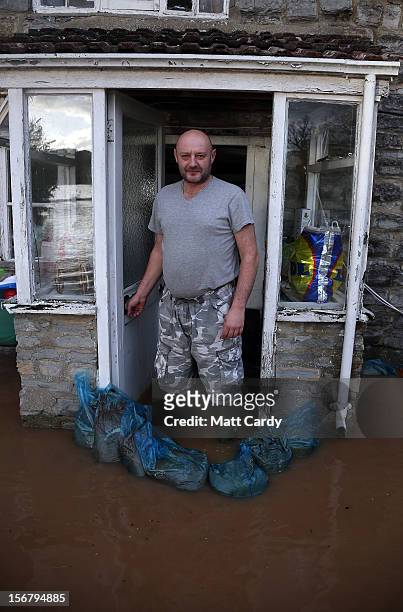 Arthur Dziewicki stands in the flood water lapping at the front door of his cottage that has been flooded close to the village of North Curry on...