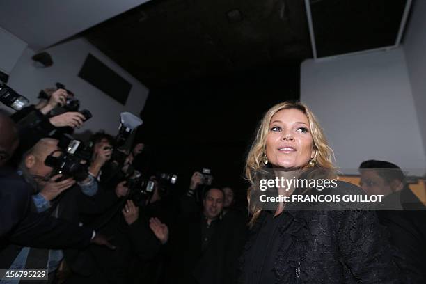 British model Kate Moss arrives to attend a book signing session for the release of her book "Kate: The Kate Moss Book" on November 21, 2012 at the...
