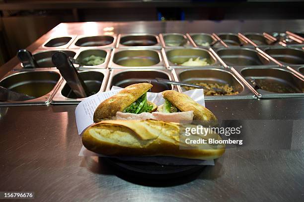 Freshly-made sandwiches stand ready for a customer's order in the kitchen of a 100 Montaditos restaurant in Madrid, Spain, on Wednesday, Nov. 21,...