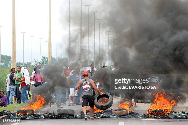 Activists of the Landless Movement block with burning tyres the BR-020 road that links Brasilia with Sao Paulo and Rio de Janeiro, during a protest...