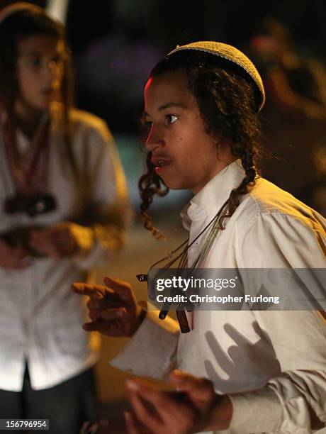 Israeli youths dance and sing to support troops on November 21, 2012 on Israel's border with the Gaza Strip. Despite widespread rumours of a...