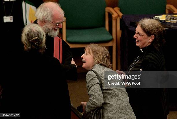 Dr Rowan Williams, the outgoing Archbishop of Canterbury, speaks to Caroline Spencer, Revd Celia Thomson and Revd Clare Edwards during a break in a...