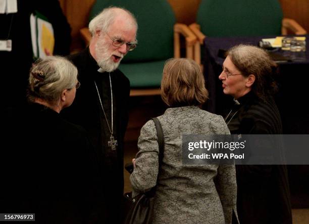 Dr Rowan Williams, the outgoing Archbishop of Canterbury, speaks to Caroline Spencer, Revd Celia Thomson and Revd Clare Edwards during a break in a...