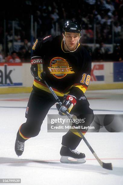 Shawn Antoski of the Vancouver Canucks looks for a pass during a hockey game against the Washington Capitals on November 5, 1993 at the USAir Arena...
