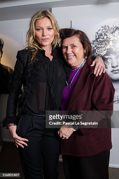 Kate Moss poses with Suzy Menkes as she attends a signing session for the book 'Kate: The Kate Moss Book' at Colette on November 21, 2012 in Paris,...