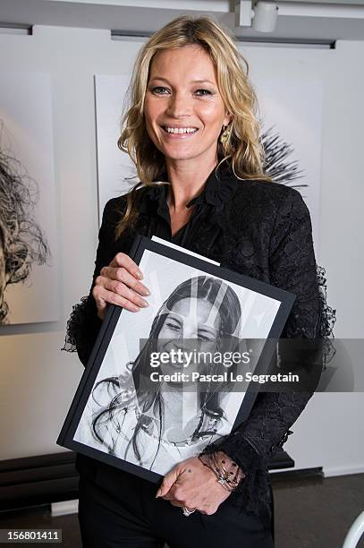 Kate Moss attends a signing session for the book 'Kate: The Kate Moss Book' at Colette on November 21, 2012 in Paris, France.