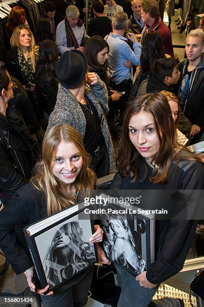 Fans, Gonse Vincent queue to attend the Kate Moss signing session for the book 'Kate: The Kate Moss Book' at Coletteon November 21, 2012 in Paris,...