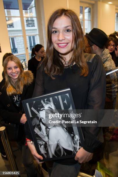 Gonse Vincent queues to attend the Kate Moss signing session for the book 'Kate: The Kate Moss Book' at Coletteon November 21, 2012 in Paris, France.