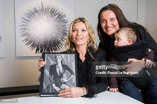 Kate Moss signs her book 'Kate: The Kate Moss Book' at Colette on November 21, 2012 in Paris, France.