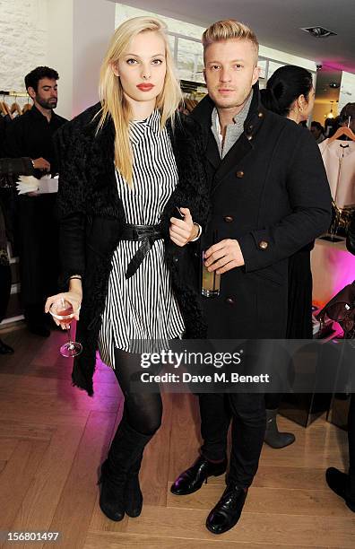 Model Dioni Tabbers and Josh Varney attend the launch of the SuperTrash London flagship store on November 21, 2012 in London, England.